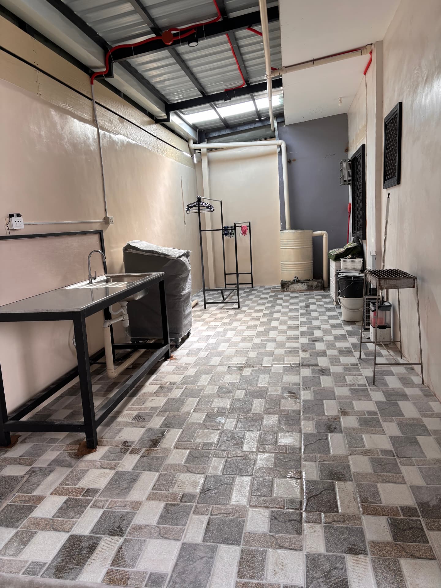 Laundry and service area with sink and grill