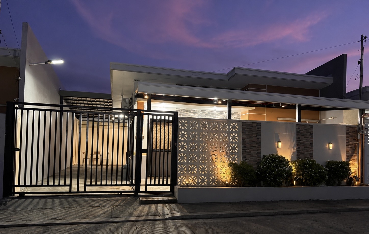 Yoshi's Zen House facade at dusk with warm lighting