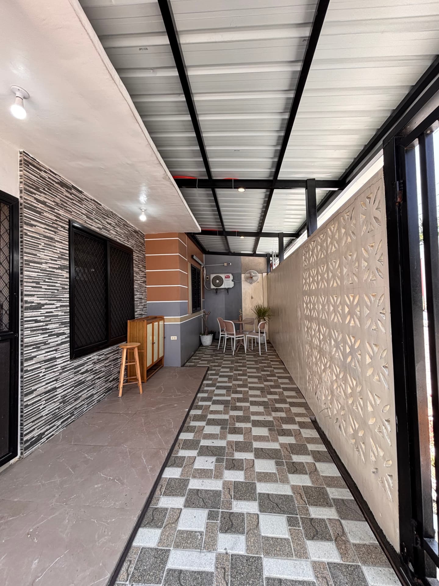 Covered patio with outdoor dining set